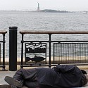 View of Lady Liberty, and a poor soul, Battery Park NYC